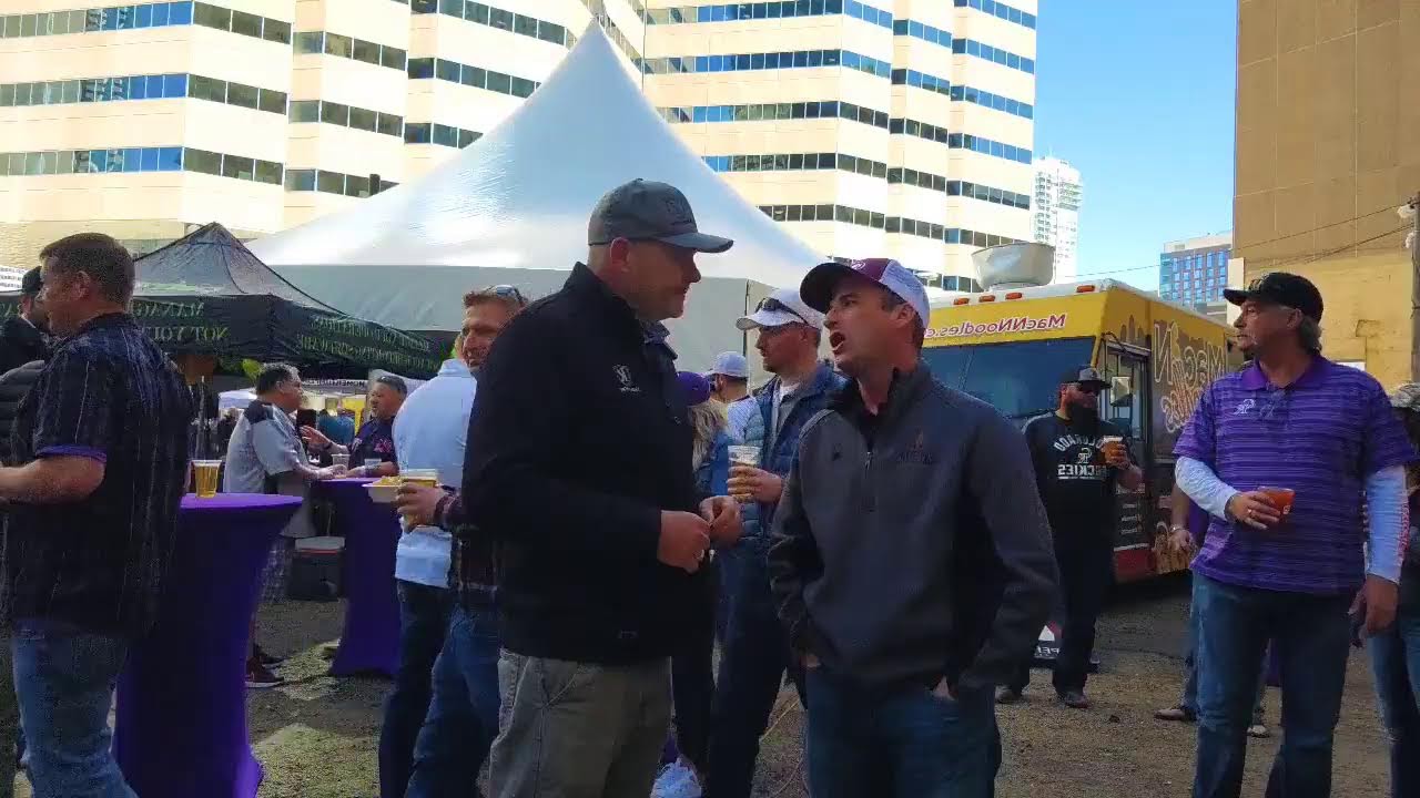 Energy professionals networking at an outdoor tailgate gathering