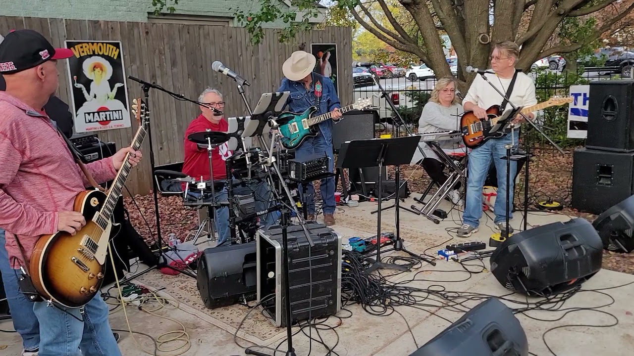 A live band playing outdoors at an Oilfield Tailgate